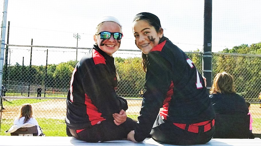 Local softball players Taylor Hafer and Ella Adam participated in the 1st Annual Madison Small Memorial Scholarship Softball Tournament to honor No. 24. Photo by Christina Milne.