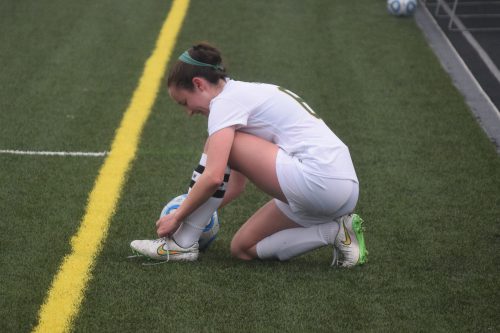 Chatham-commit Victoria Vernail needed a minute to tie her shoe before resuming play in the Lady Vikings win over the Rams on April 28 in Purcellville. Full photo gallery by Owen Gotimer!