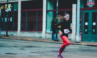 Wellness Wednesday: Guide to Better Running Female running down street