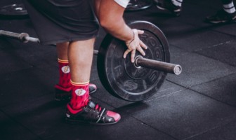 Wellness Wednesday: The Power of “Good Strength” person strength training weight lifting