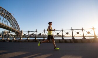 Wellness Wednesday: Common Running Injuries Man running on a bridge