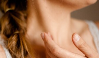 Wellness Wednesday: Neck Problem Leading to Pain Elsewhere Woman resting her hand on her neck